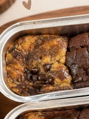 Soft cookies in a tin, some filled with Nutella